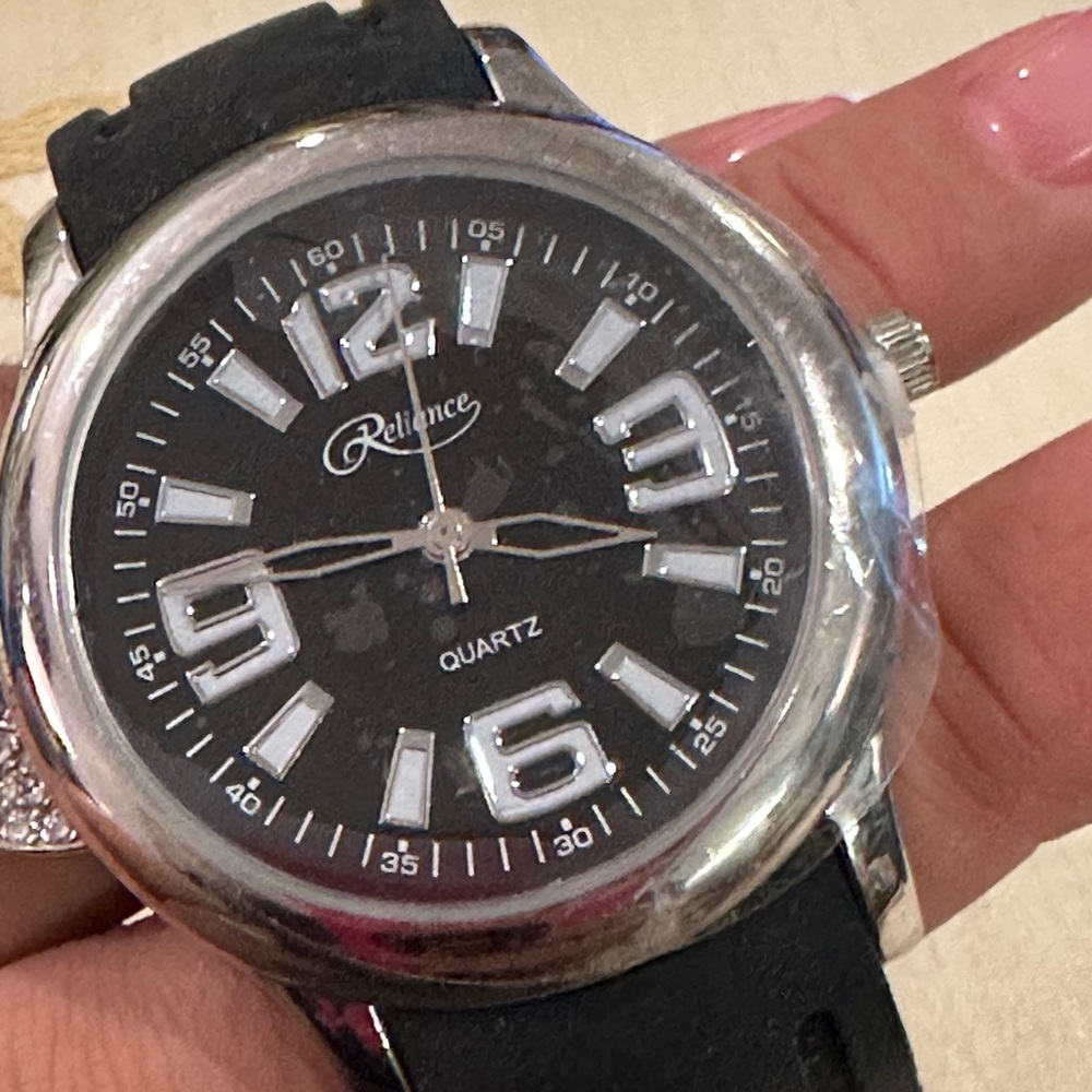 Reliance Men’s Quartz Silver Tone Watch w/ Black Face and Rubber Band.